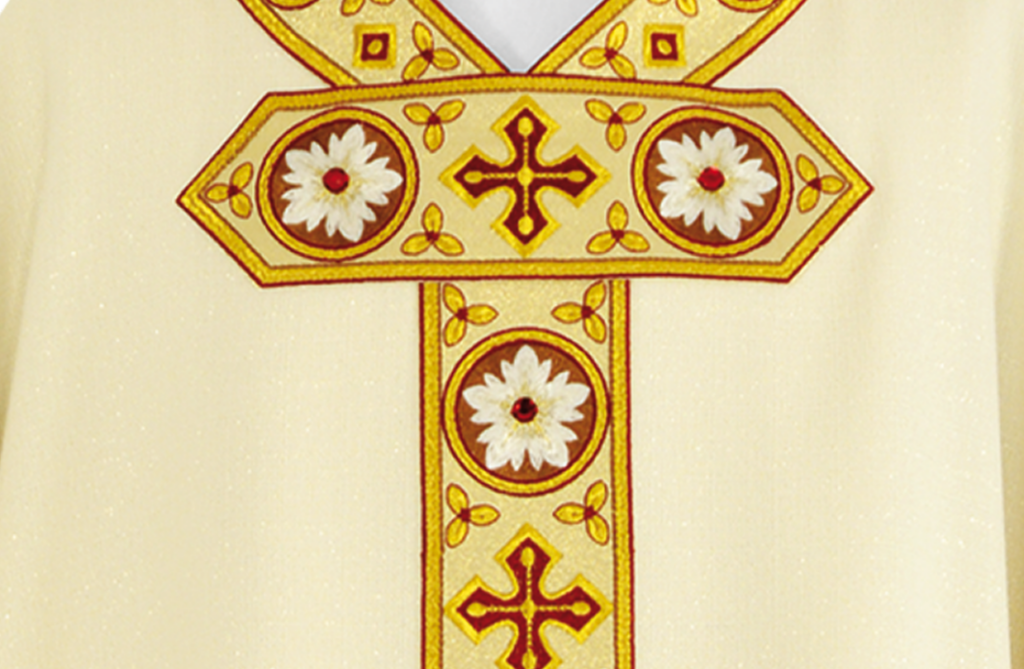 Detalhe ornamental dourado da coleção litúrgica Cordeiro de Deus